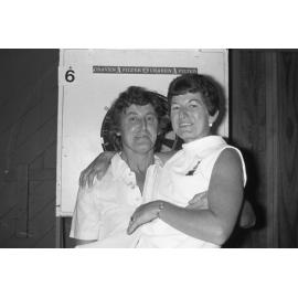 Man and woman with darts board, Ipswich, January 1978