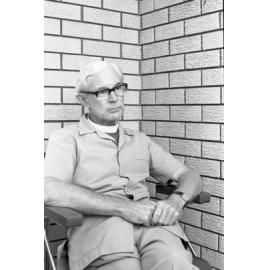 Unidentified bishop wearing glasses and pale safari suit, Ipswich, February 1978