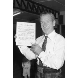 Roderick MacSwan receiving a life membership with Ipswich Thistle Pipe Band, Ipswich, November 1977