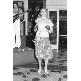Unidentified percussionist with maracas and guitarist in a band, Ipswich, February 1978