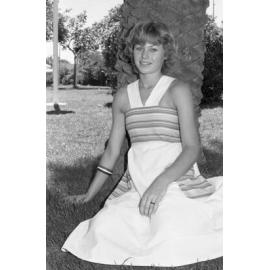 Unidentified young woman sitting in Memorial Gardens, Ipswich, February 1978
