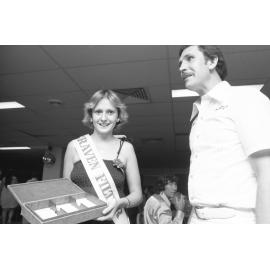 Unidentified cigarette girl and man in the Palais Royal Hotel for the Country Music Talent Quest program, Ipswich, Queensland, February 1978