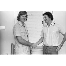 Two unidentified men shaking hands, Ipswich, Queensland, February 1978