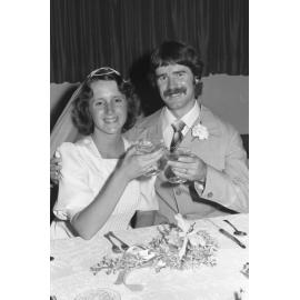Unidentified newlyweds toasting, Ipswich, Queensland, February 1978