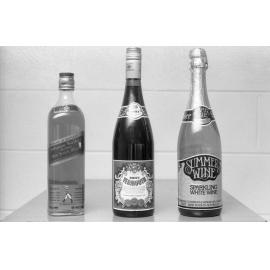Bottles of Johnnie Walker Scotch Whiskey, Thomas Hardy Sweet Vermouth, and Summer Wine Sparkling White Wine, photographed by the Queensland Times for advertising, Ipswich, Queensland, February 1978