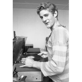 Unidentified man playing vinyl records, Ipswich, Queensland, February 1978
