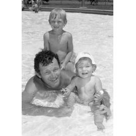 Father swimming with his kids, Bundamba, November 1977