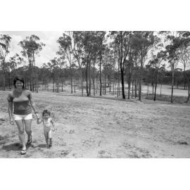 Thought to be mother and daughter at a new park, Ipswich, November 1977