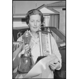 Unidentified lady with Equestrian trophy, the Ray Hood Memorial Trophy and banners, Gatton Show, Gatton, July 1985