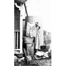 Woman hand washing outside, 1920s