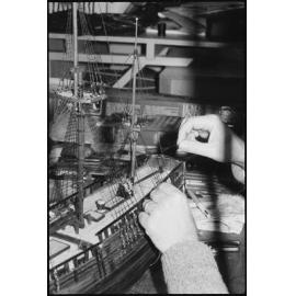 Unidentified model builder building a model of the HMS Endeavour 1768, Ipswich, July 1985
