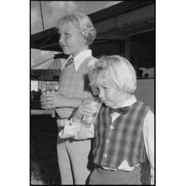 Two unidentified children drinking water, Ipswich, July 1985