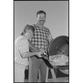 Unidentified couple using a concrete mixer, Ipswich, July 1985