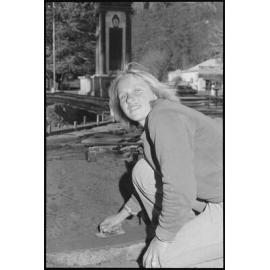 Unidentified woman laying concrete slab, Ipswich, July 1985
