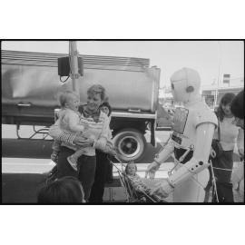 Prime Computer mascot greeting pedestrians outside of Ipswich & West Moreton Building Society, corner East and Limestone Streets, Ipswich, July 1985