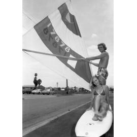 Models on a windsurfing board to promote the Prince Alfred Hotel, Ipswich, November 1977