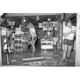 Store with a broken window, Ipswich, November 1977