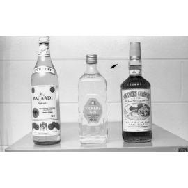 Bottles of Bacardi Rum, Vickers Gin, and Southern Comfort whiskey liqueur, photographed for advertisements in the Queensland Times, Ipswich, Queensland, February 1978