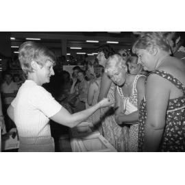 Unidentified member of the audience shows crowd snake bite at Ram Chandra's Snake Demonstration in Reid's, Ipswich, February 1078