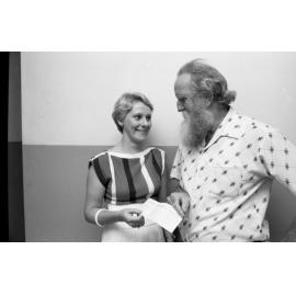 Frank Ryder of the Ipswich Beardies presenting an unidentified young woman with a cheque, Ipswich, 22nd March 1977