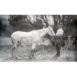 William O'Connell with a horse at Colleges Crossing, Ipswich, 1923