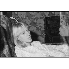 Unidentified woman leaning on couch, Ipswich, July 1985