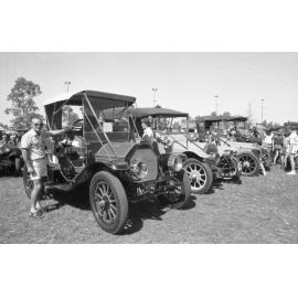 Man with 1911 Mitchell Roadster at the 1978 Australian International Veteran and Vintage Motor Rally at the Ipswich Showgrounds, Ipswich, April 1978