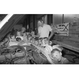 Man teaching children about cars, Ipswich, October 1977