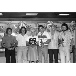 Unidentified people with trophies and a shield award, Ipswich, December 1979