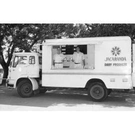 Two men with the Jacaranda milk truck, Ipswich, March 1978