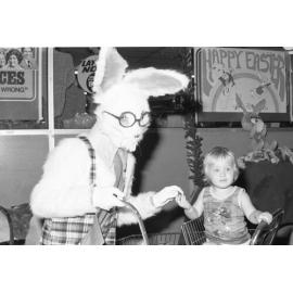 The Big W Easter Bunny giving a young child an Easter Egg, Booval, Ipswich, March 1978