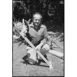 Man holding a toy hobby horse, Ipswich area, January 1986