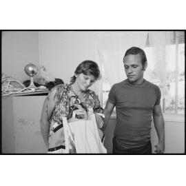 Unidentified couple holding clothes, Ipswich, January 1986