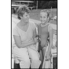 Unidentified swimmers at swimming pool, January 1986
