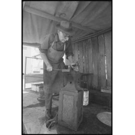 Unidentified man using an anvil, Ipswich, January 1986