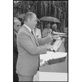 Unidentified man reading the "Freedom of the City" scroll to the crew of H.M.A.S. Ipswich, in front of the Ipswich Civic Centre, January 1986