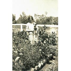 Myra Leard in Queenie Jones' garden at Oakleigh, Redbank Plains, Ipswich, c.1920