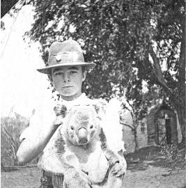 Henry Mervyn (Merv) Jones holding a  koala at  'Oakleigh', Redbank Plains, early 1910s