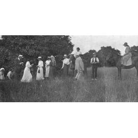 Group of people collecting mangoes in the orchard at  Oakleigh (house), Redbank Plains, Ipswich, c.1917