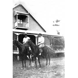 Oakleigh, in background with Merv Jones and Myra Leard on horseback, Redbank Plains, Ipswich, 1920s.