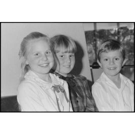 Debra King and two other unidentified children sitting together, Ipswich, July 1985