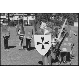 Group of unidentified children dressed in cardboard costumes, Ipswich, July 1985