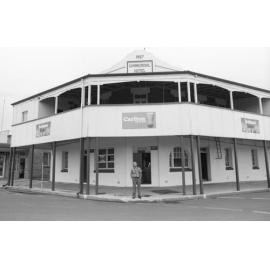 Unidentified man standing in front of the Commercial Hotel, Gatton, Lockyer Valley, February 1978