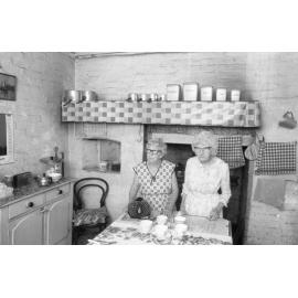 Two unidentified ladies in what is thought to be the kitchen of Notnel, 6 Burnett Street, West Ipswich, February 1985