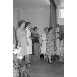 Unidentified women with Margery Brier-Mills on stage for speeches during the Mayoress' Lunch, Ipswich, August 1980