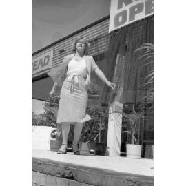 Unidentified woman modelling in a fashion show at an unidentified shopping complex, Ipswich, September 1980