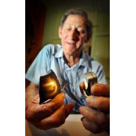 Bob Deering with a piece of the bomb he found in White Rock, Ipswich, September 2003