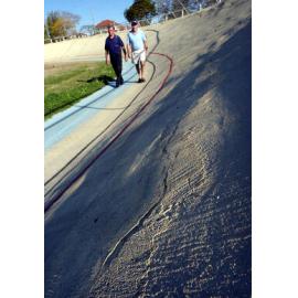 Two unidentified men walking along track in velodrome, Ipswich, September 2003