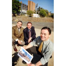 Paul Pisasale, former Mayor and other unidentified men, looking at some architecture plans for the new Day Surgery Hospital, Ipswich, September 2003