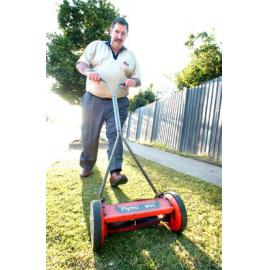 Ed Holmes pushing a lawnmower, Ipswich, September 2003